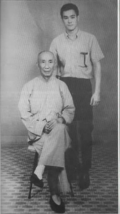 A black and white photo of two men standing next to each other.