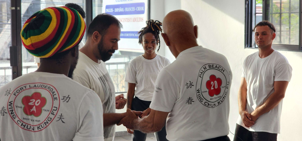 A group of men are shaking hands in a room.