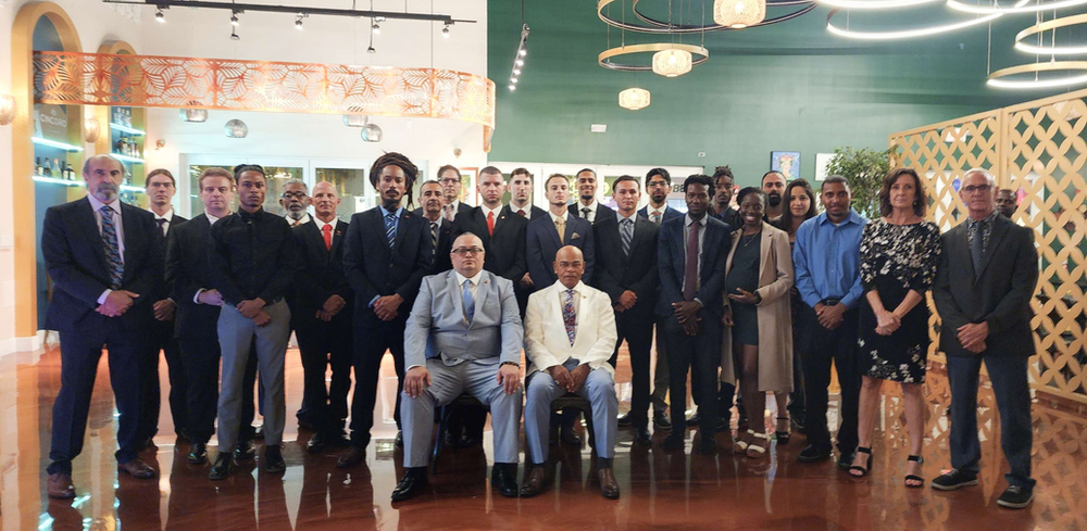 A group of people are posing for a picture in a room.