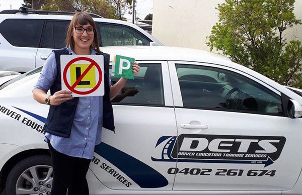 Girl with a P2 license after passing her driving lessons in Horsham