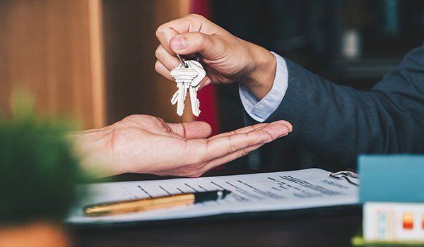 Giving House Keys To Woman — Columbus, GA — Capparelle's Insurance