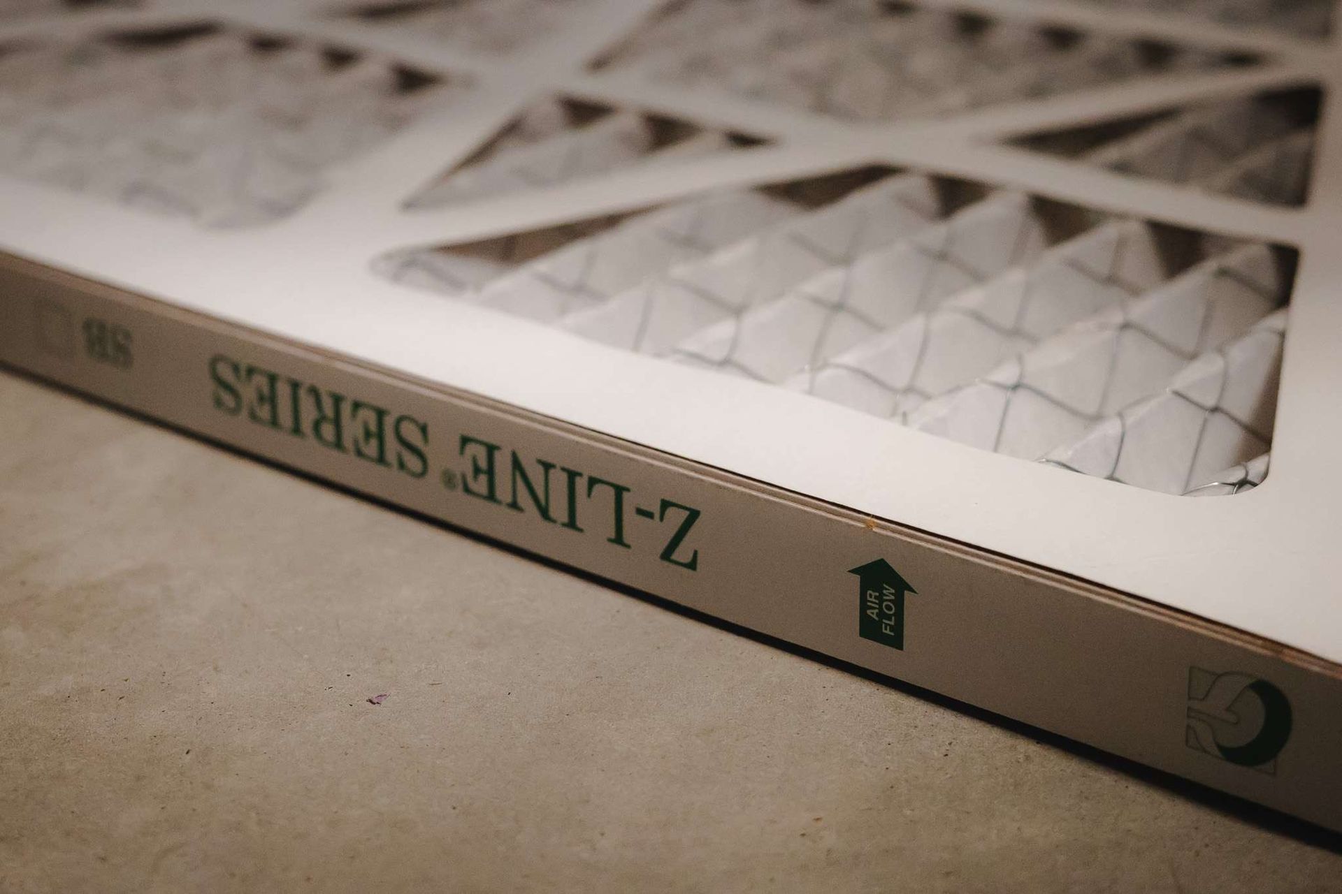 Close-up of a Z-Line Series air filter with an arrow indicating airflow direction.