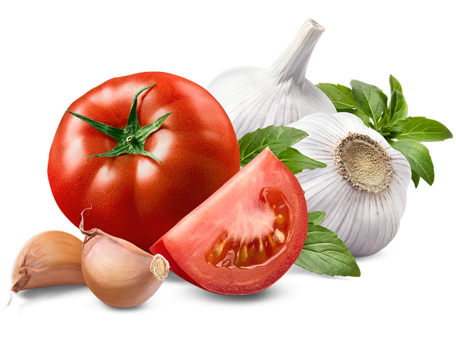 a tomato garlic and onion on a white background