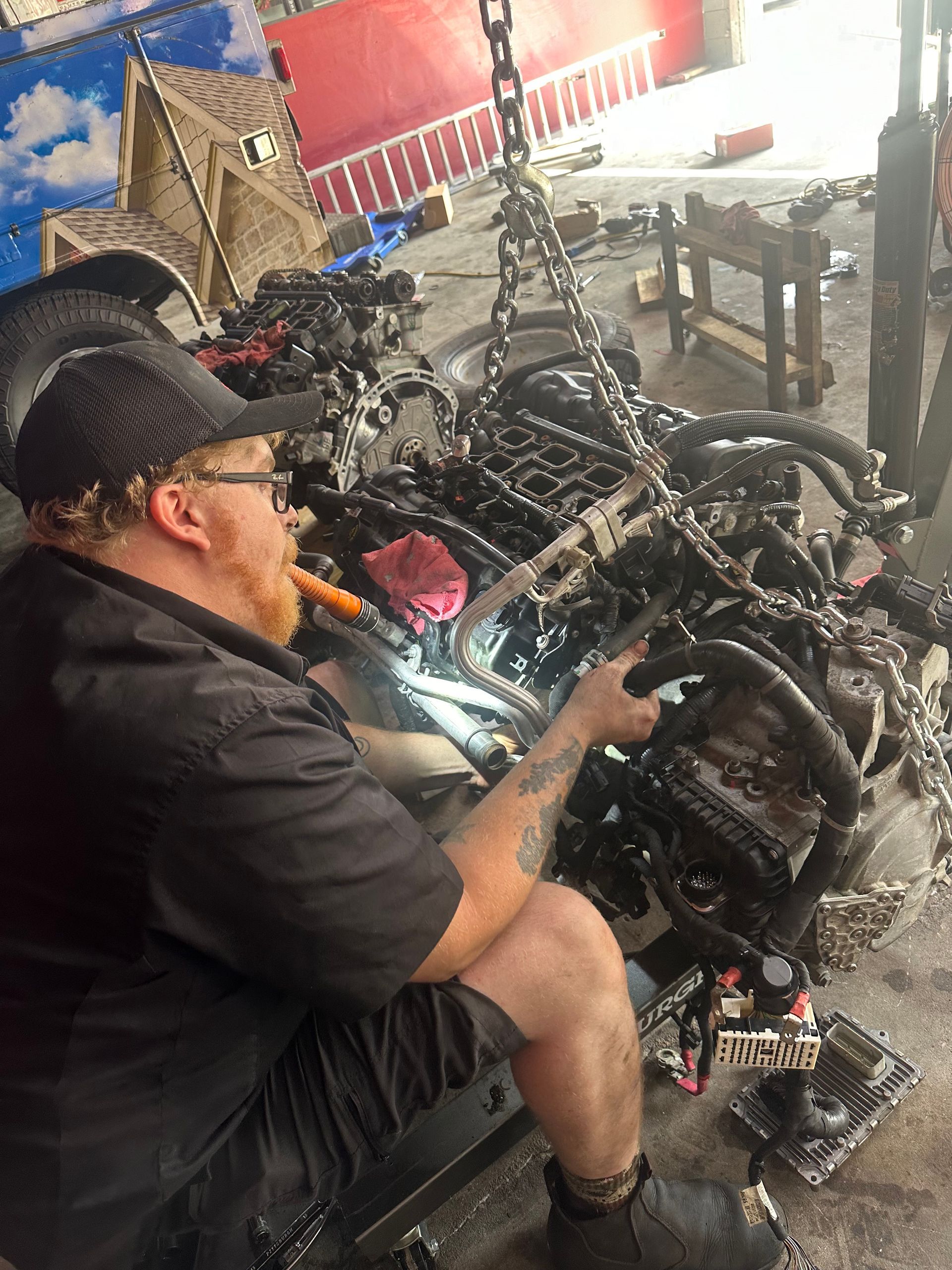 Mechanic working on engine | Garage 850