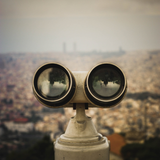 A pair of binoculars looking out over a city