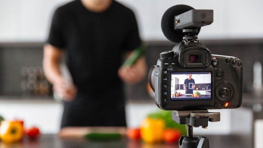 guy filming himself for his small restaurant business