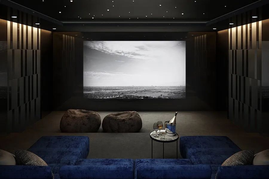 A Home Theater With a Large Screen and a Blue Couch — Audiomation in Nabiac, NSW