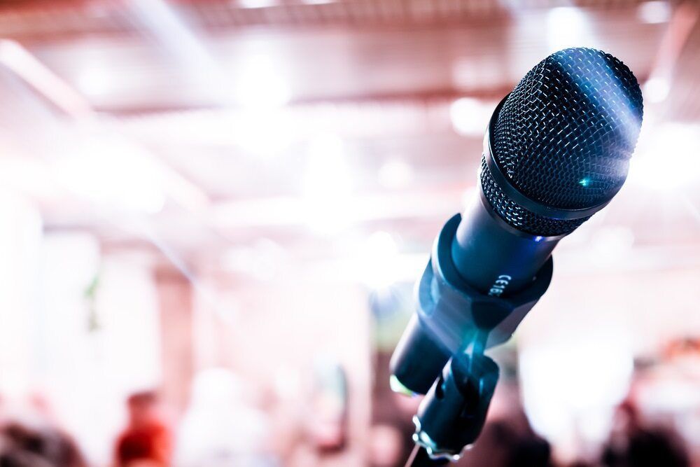 A Microphone is Sitting on a Stand in Front of a Crowd — Audiomation in Nabiac, NSW