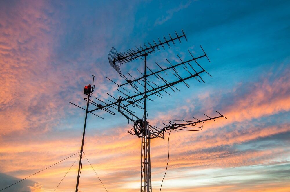 A Bunch of Antennas Are Silhouetted Against a Sunset Sky — Audiomation in Nabiac, NSW