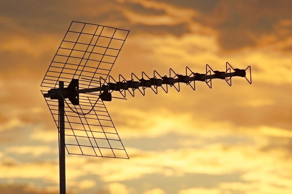 An Antenna is Silhouetted Against a Cloudy Sky at Sunset — Audiomation in Bulahdelah, NSW
