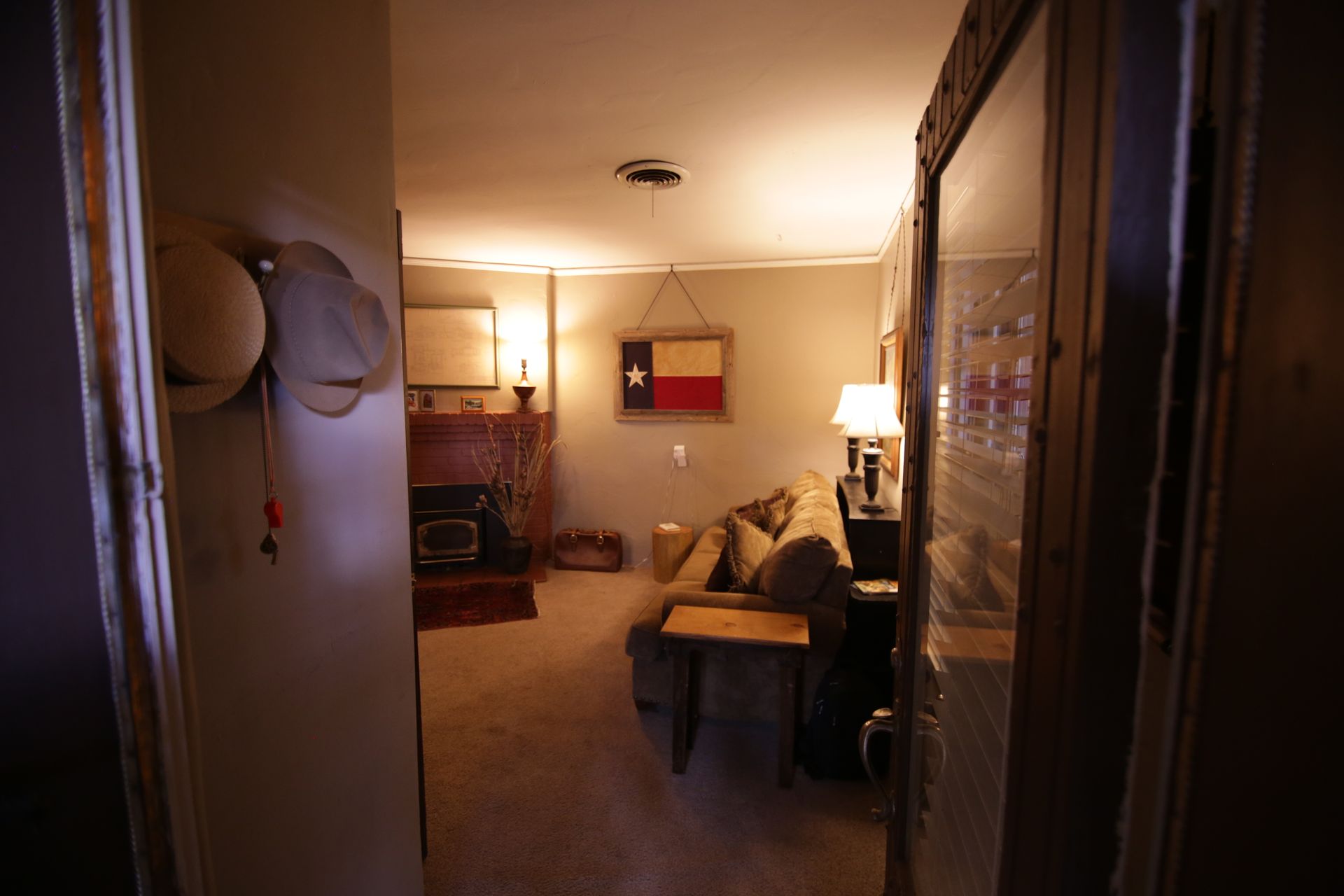 A living room with a texas flag on the wall