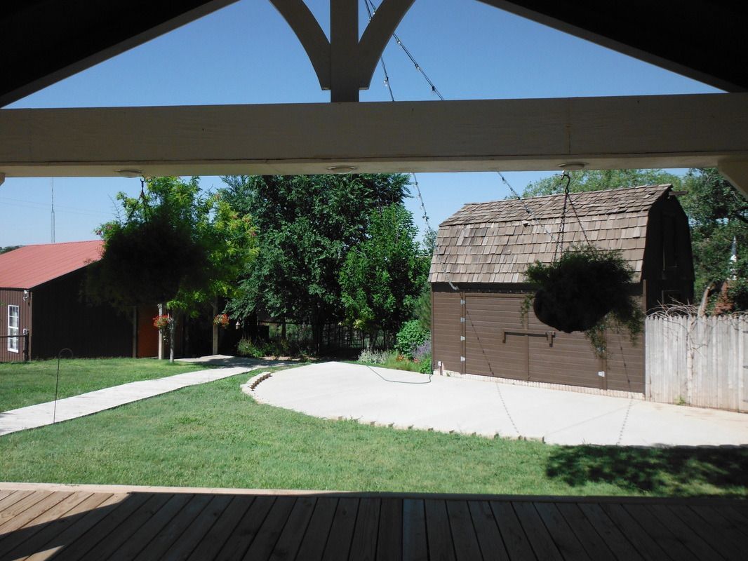 A view of a barn from a covered area