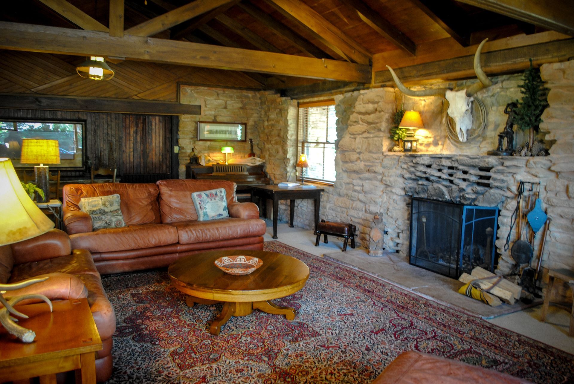 A man and a woman are sitting under a covered porch.