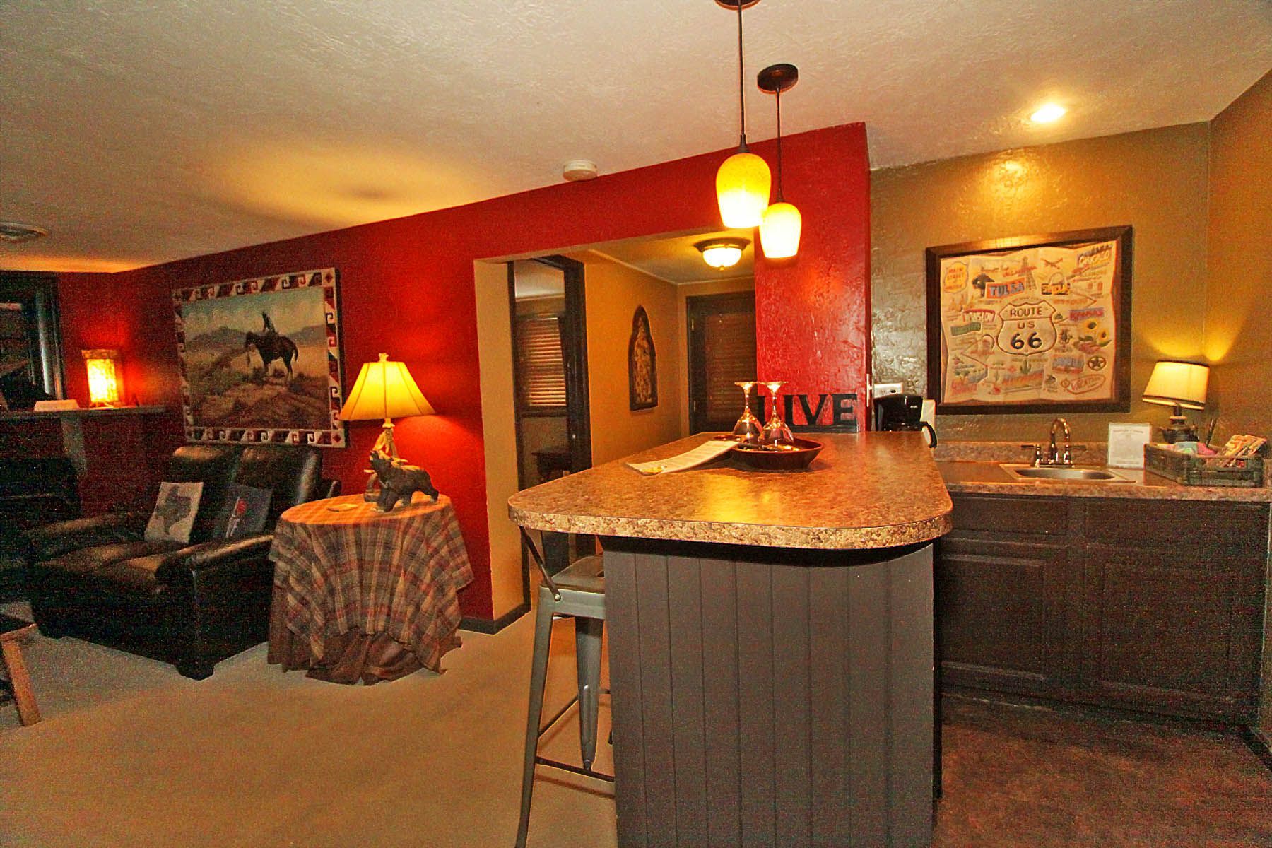A kitchen with a bar and a sign that says love