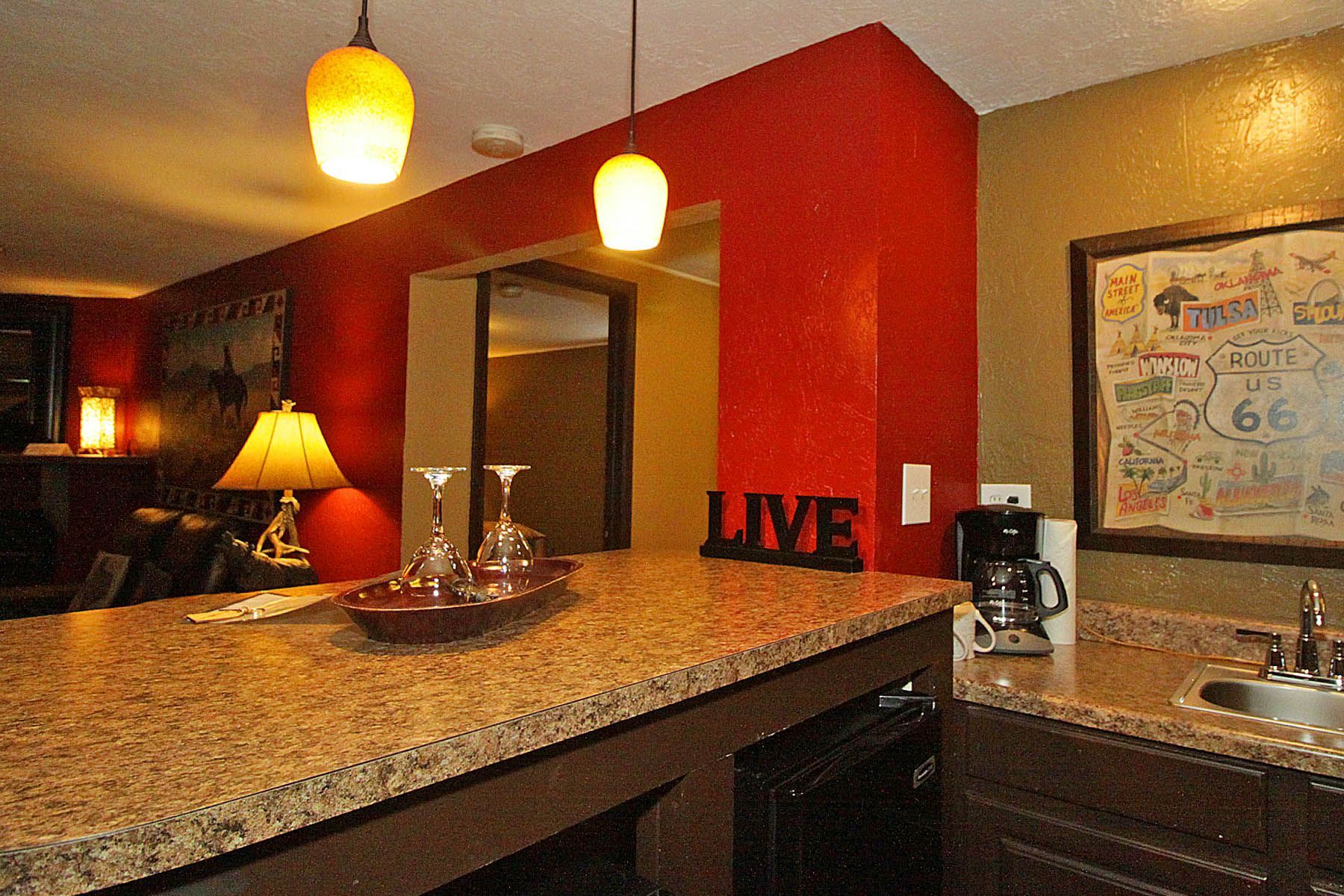 A kitchen counter with a sign that says live on it
