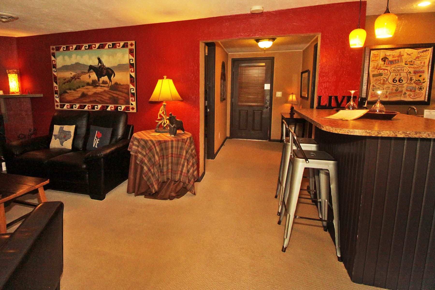 A living room with a couch and a table and a sign that says love