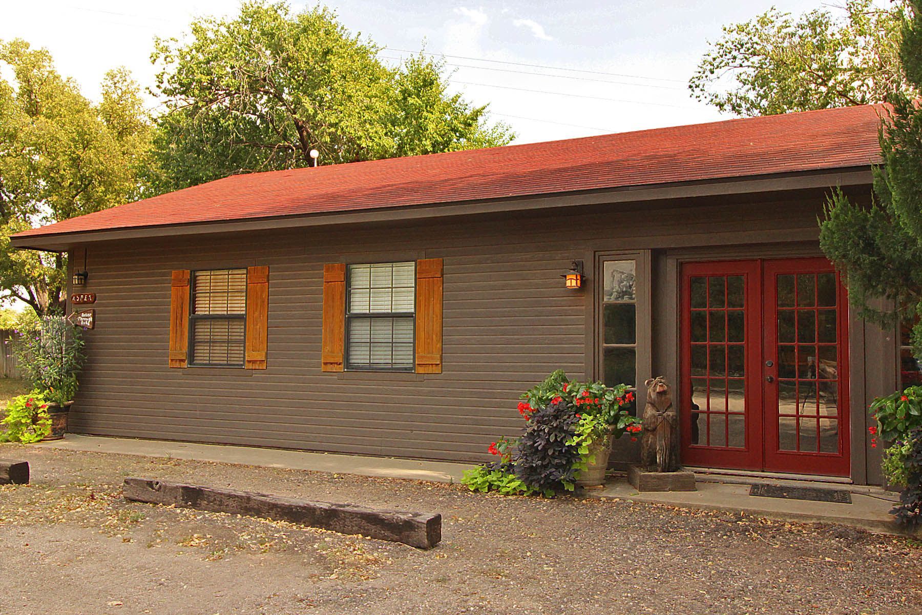 A house with a red roof and red doors