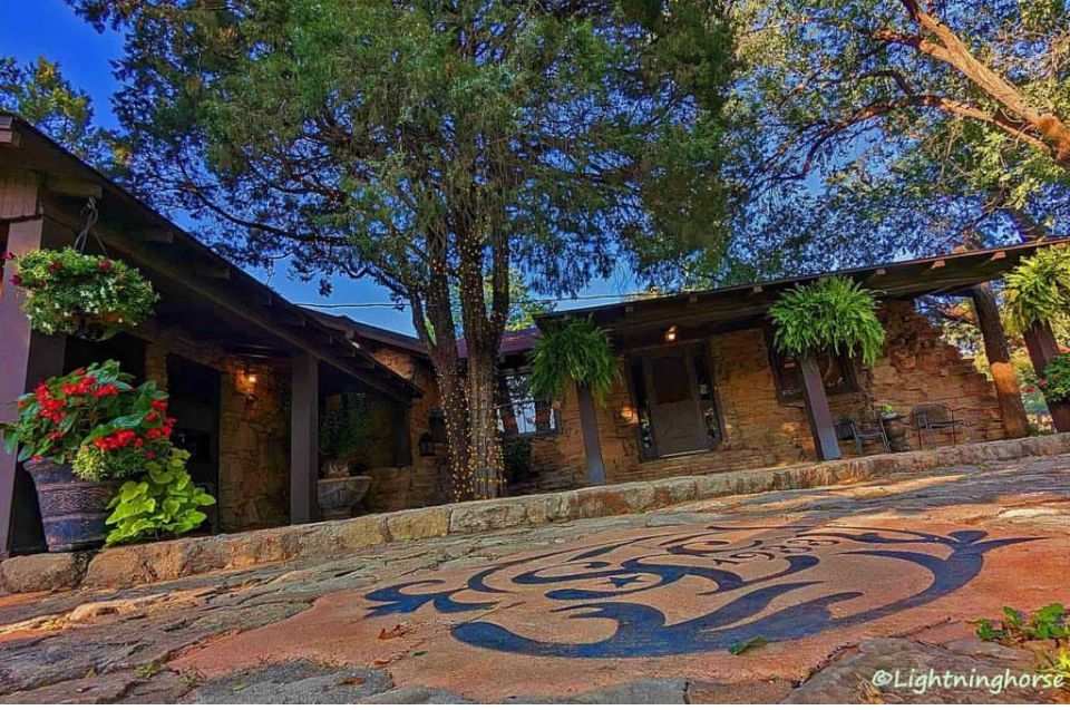 A house with a large tree in front of it