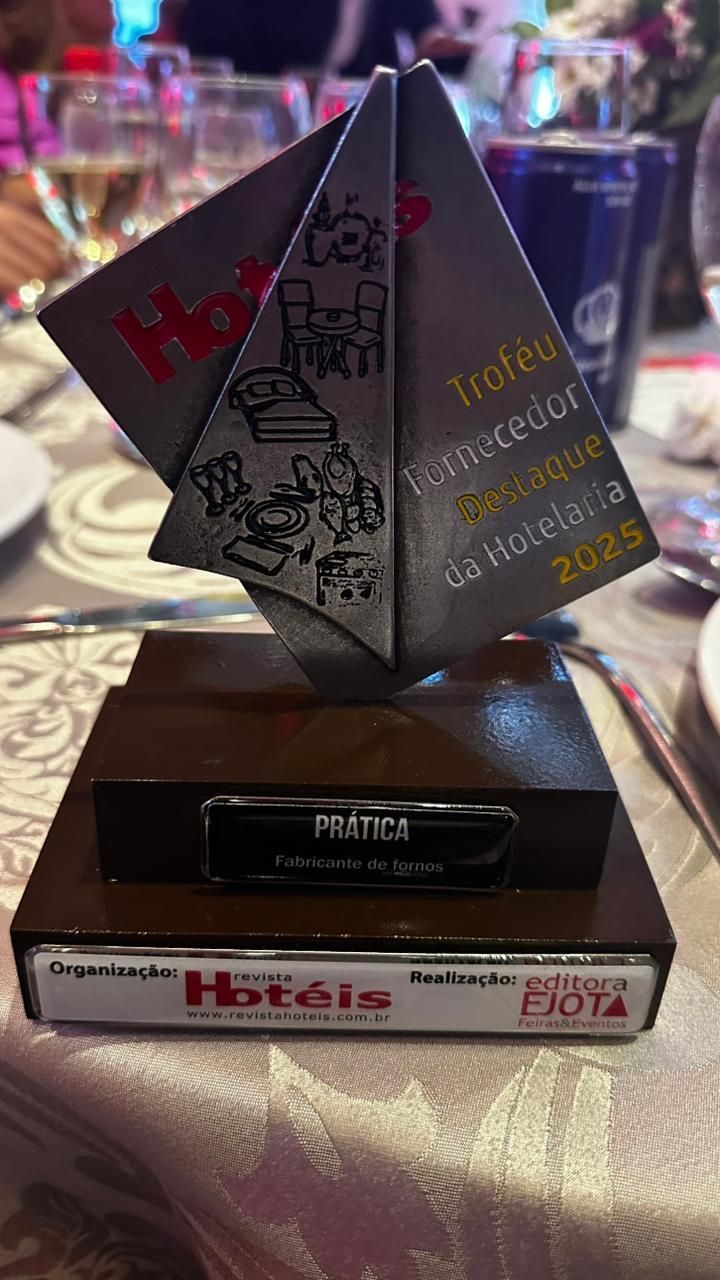 Trophy on a table; reads 