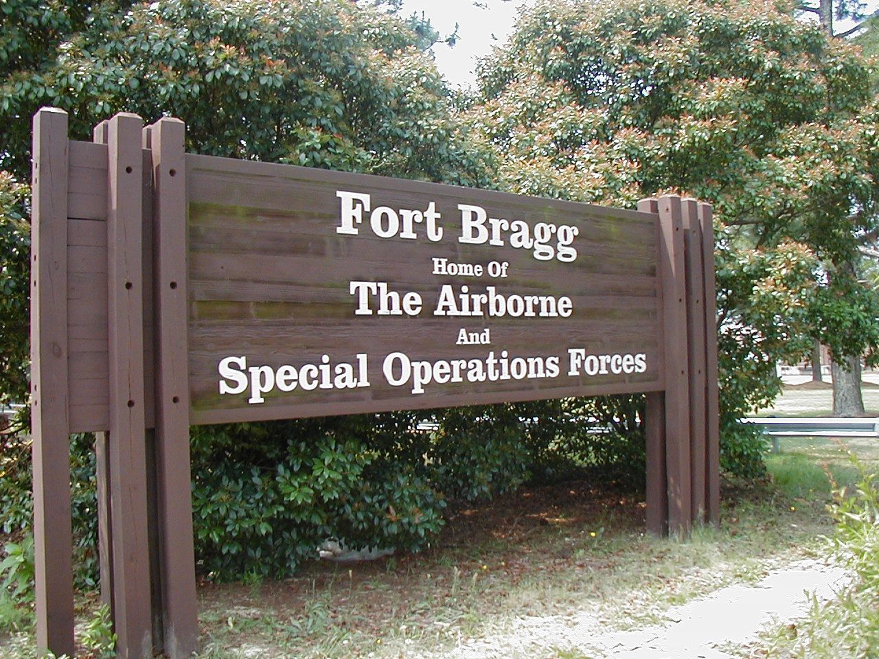 Wooden sign marking entrance to Fort Bragg, home of The Airborne and Special Operations Forces in Fayetteville, NC.