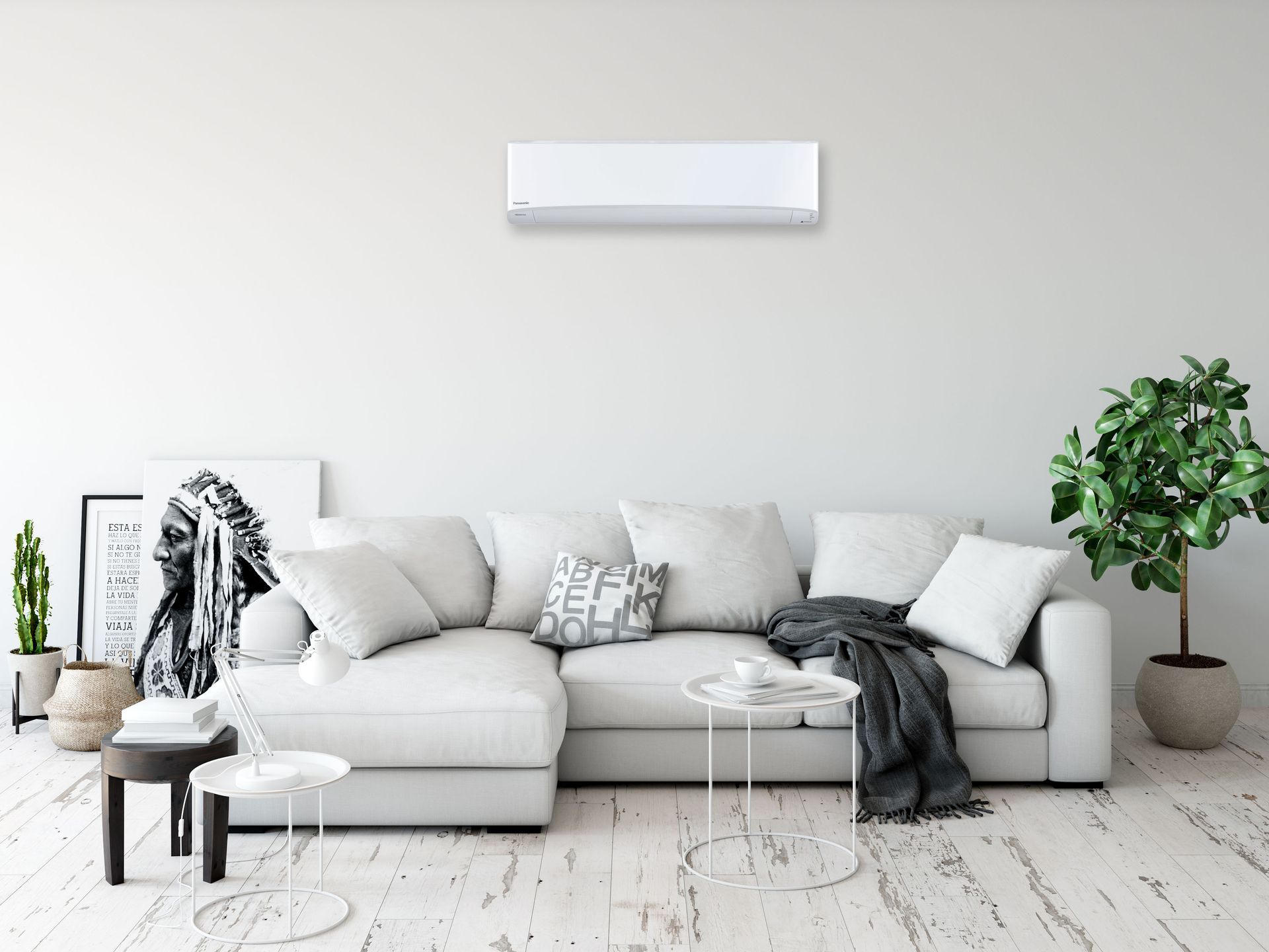 White living room with a couch, coffee tables, plants, and an air conditioner.