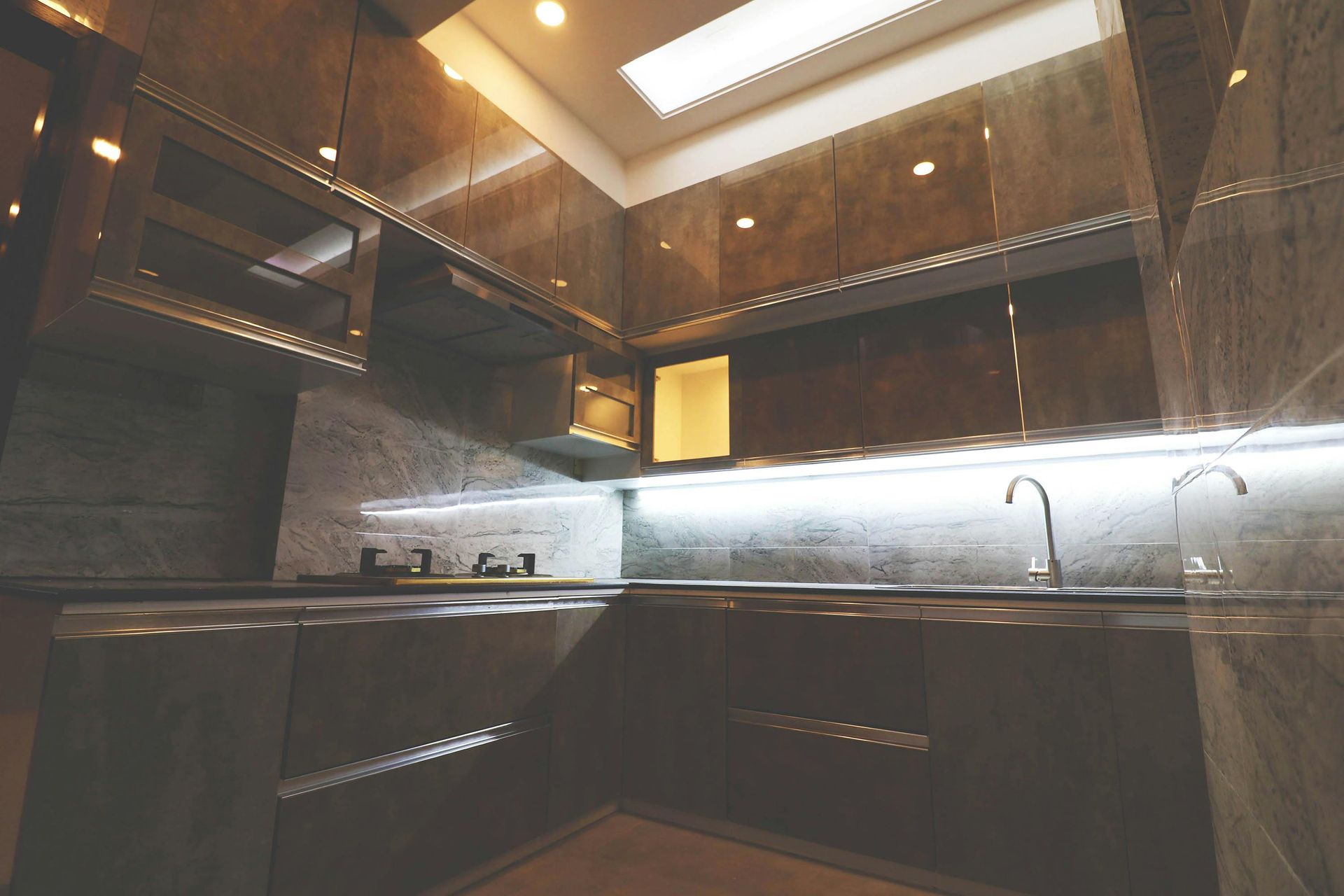 A kitchen with stainless steel appliances and a sink.
