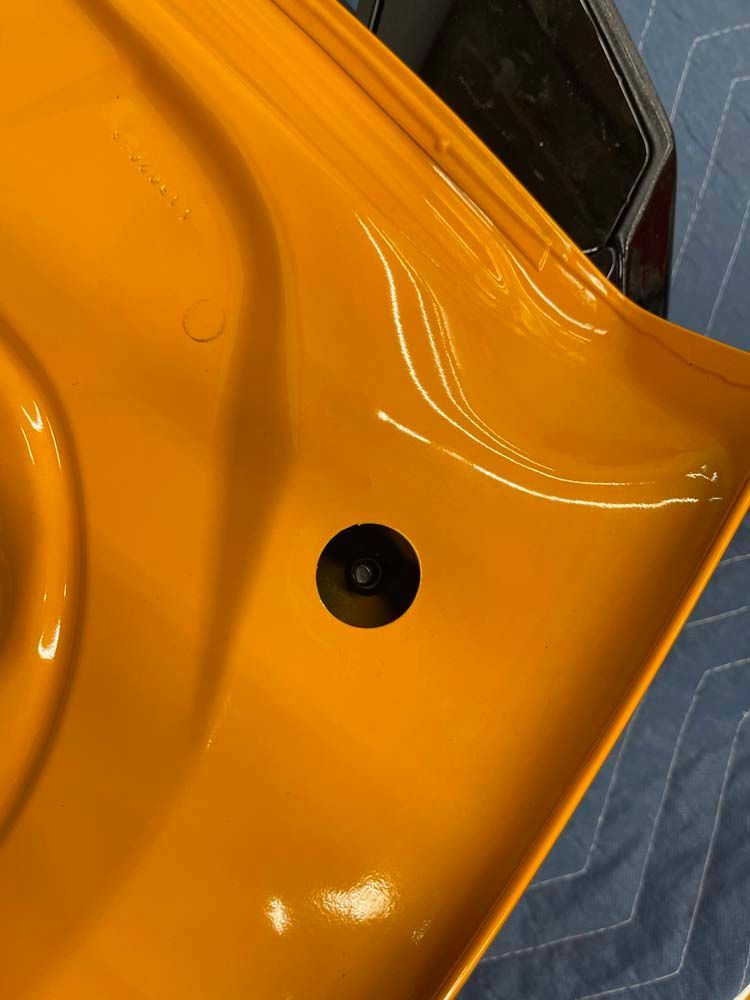 A close up of a yellow object with a hole in the middle.