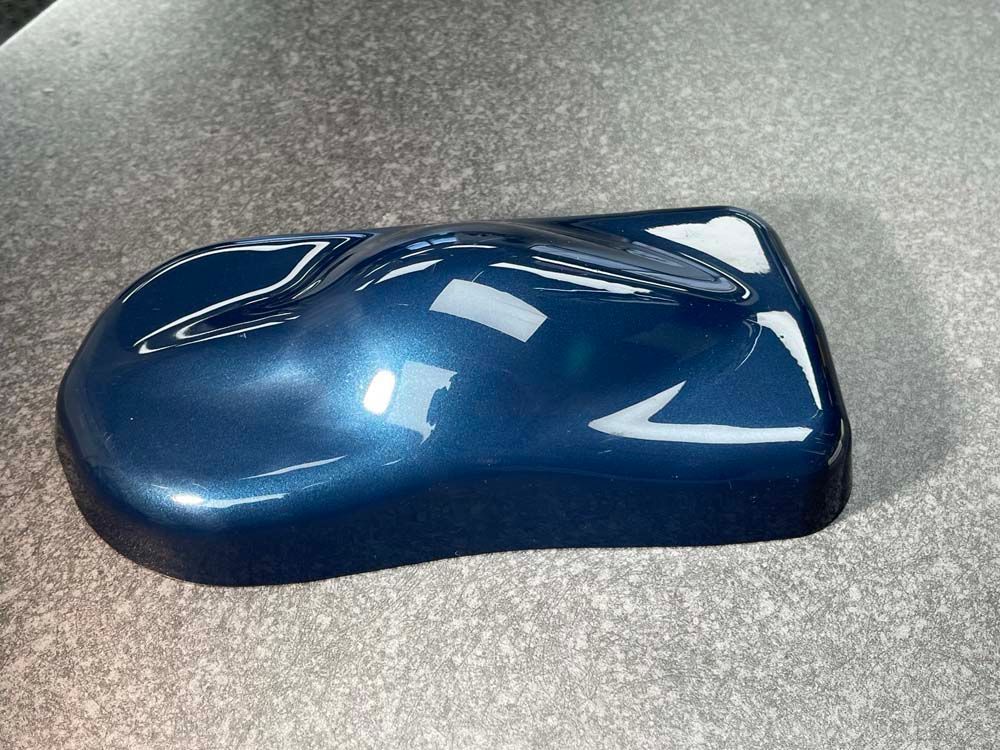 A blue paint sample is sitting on a table.