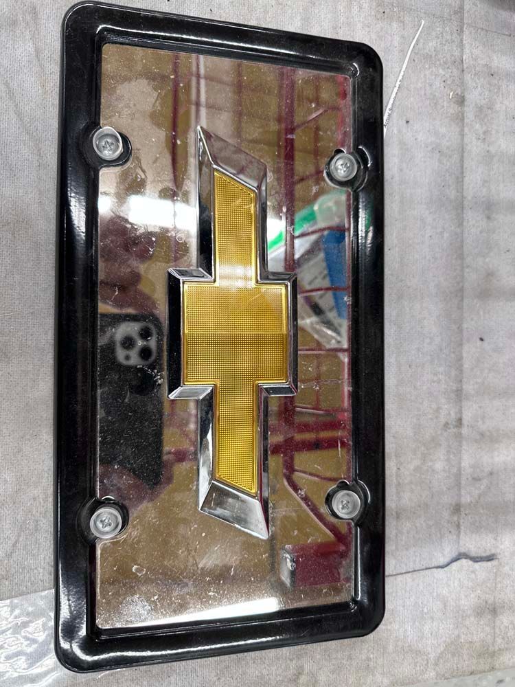 A license plate frame with a chevrolet logo on it