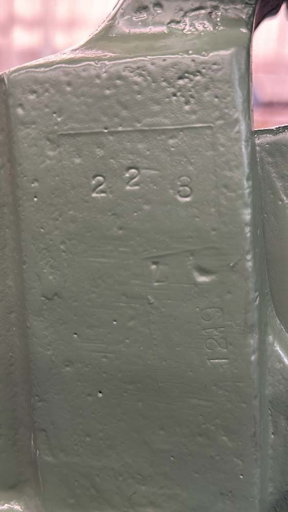 A close up of a piece of metal with numbers on it.