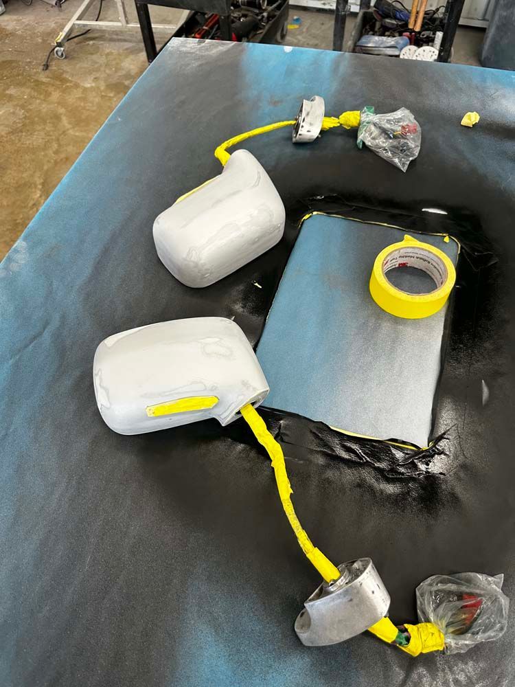 A table with a bunch of bottles and tape on it.