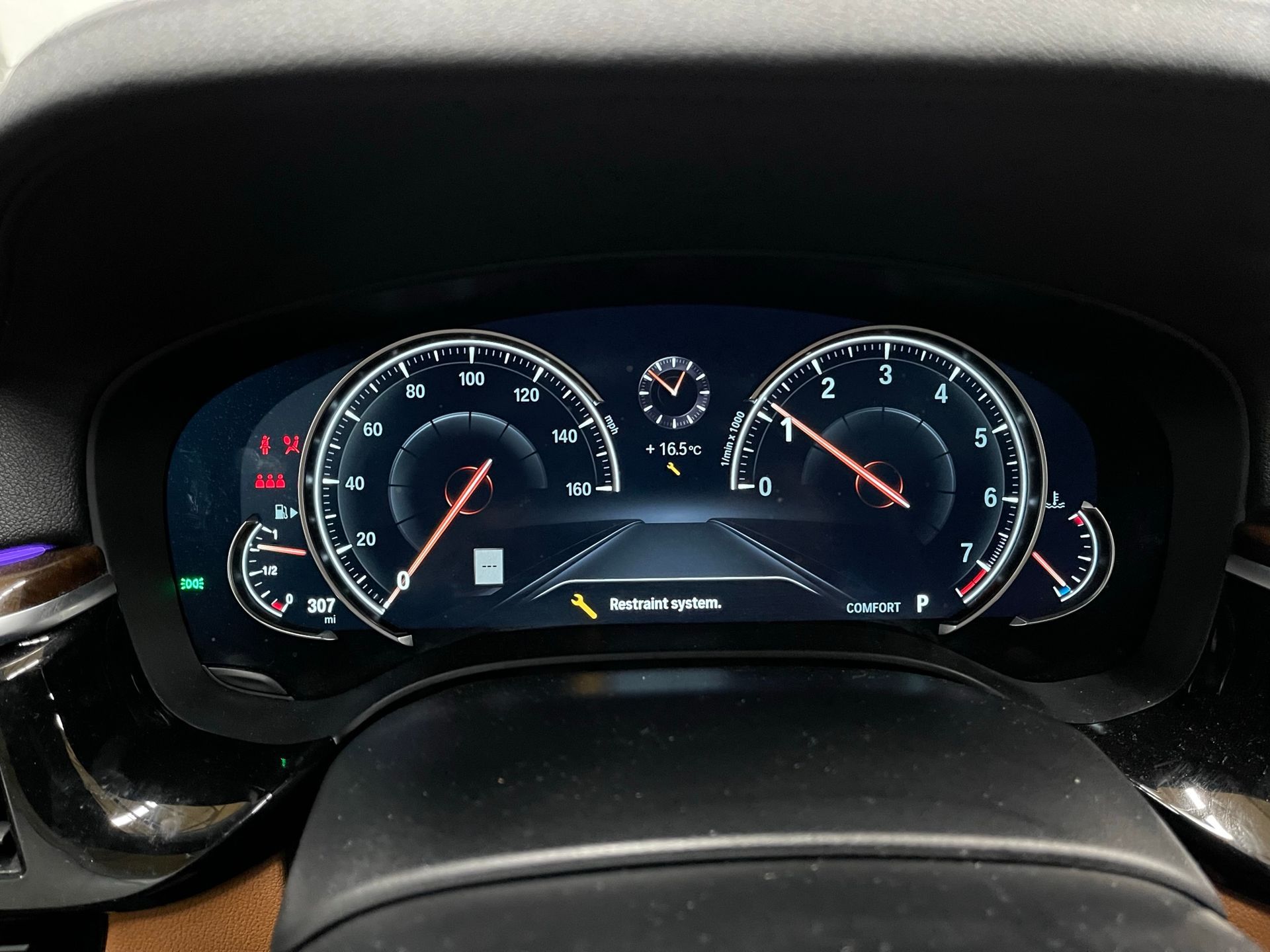 A close up of a car dashboard with a digital display