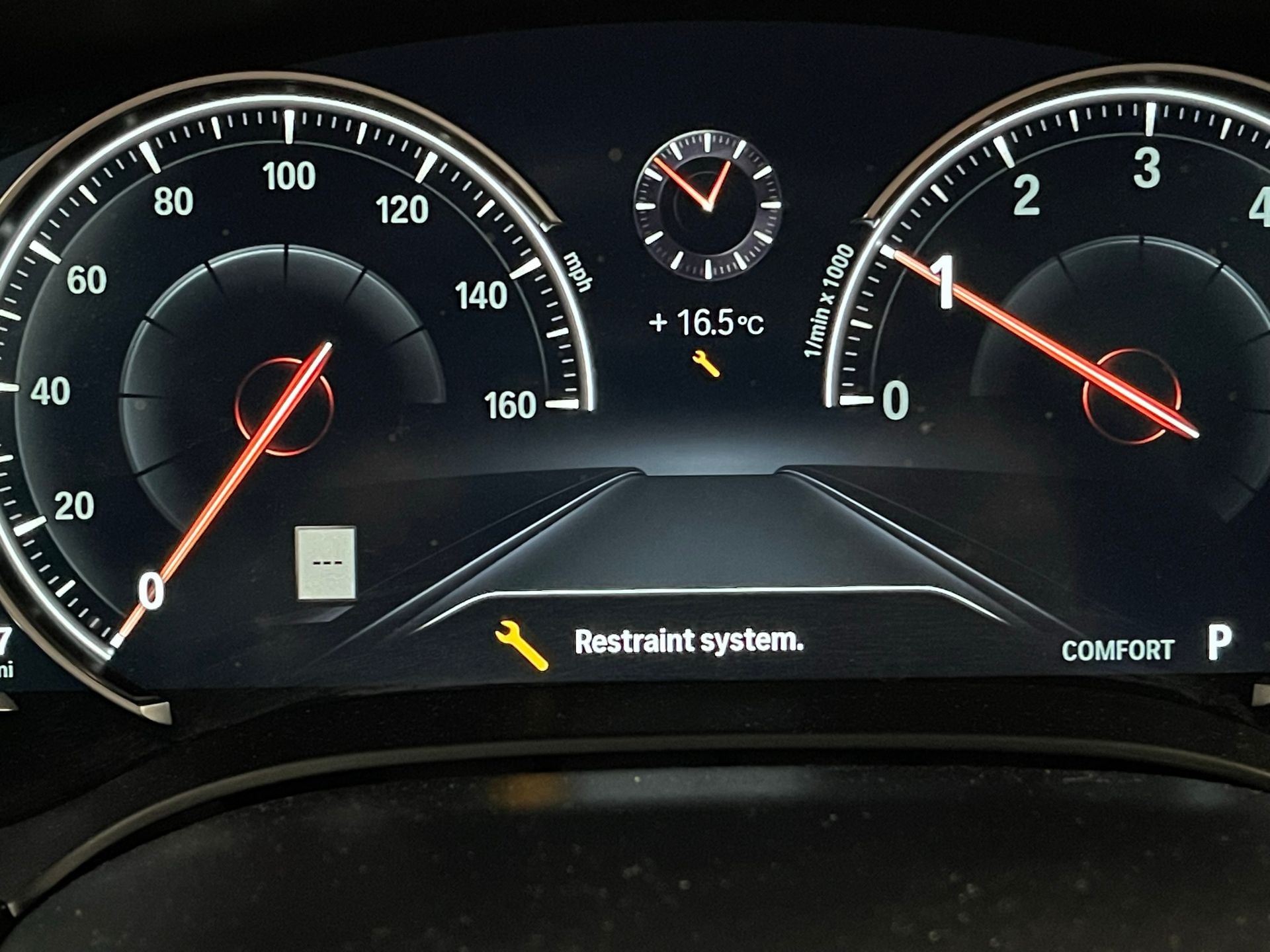 A close up of a car dashboard with the word restrained on it