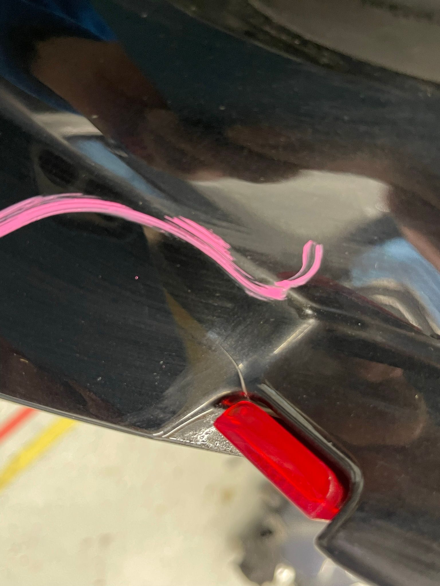 A close up of a red light on the side of a car.