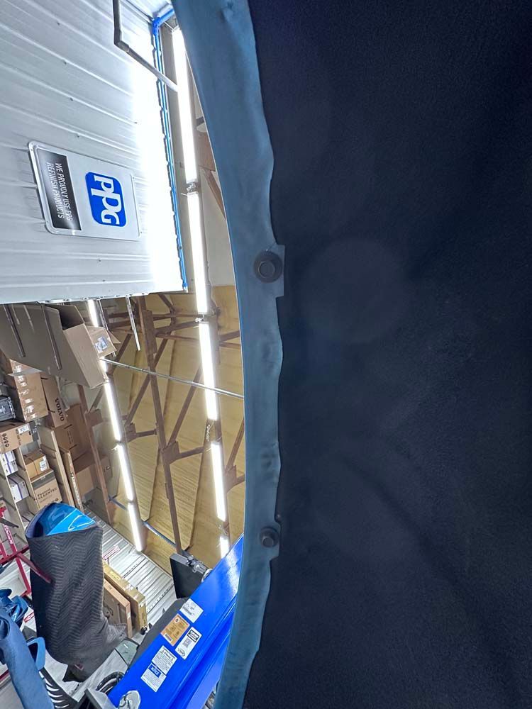 A warehouse with a sign that says ppg on it