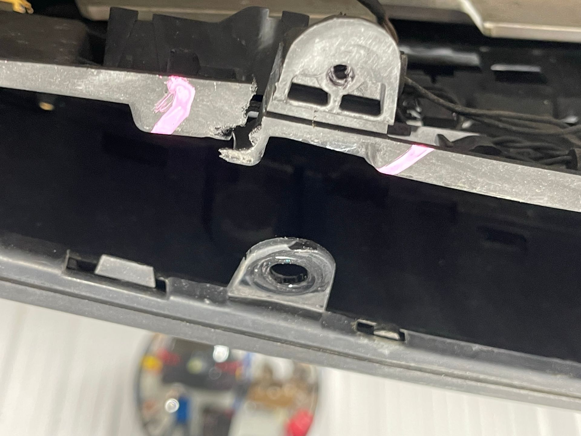 A close up of a car bumper with a hole in it.