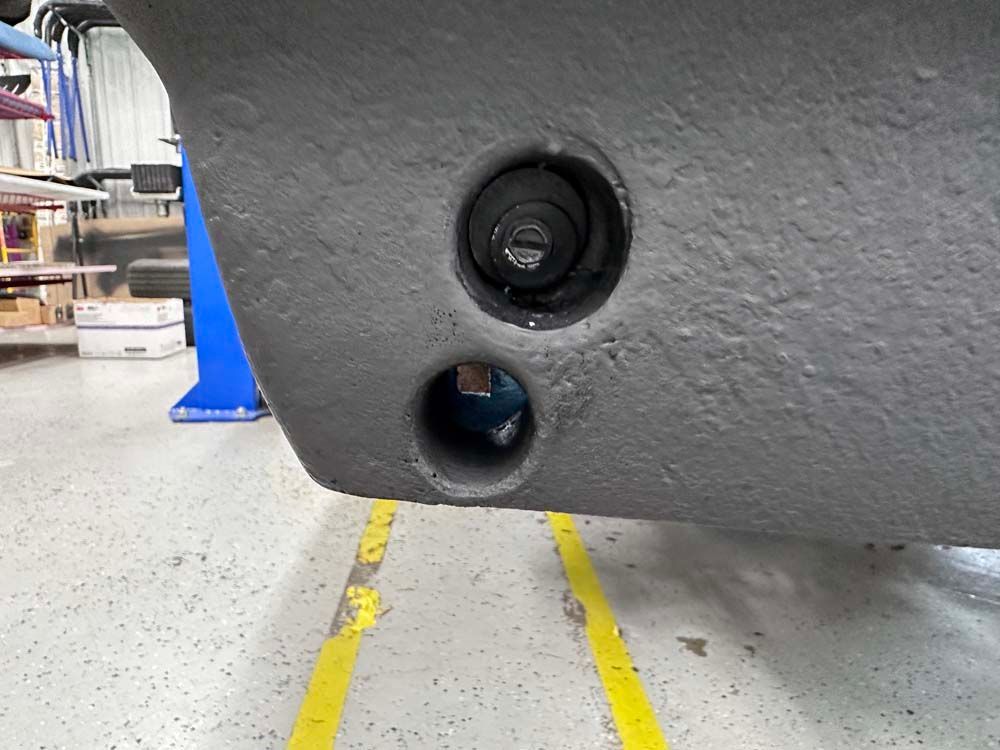 A close up of a car 's bumper with two holes in it