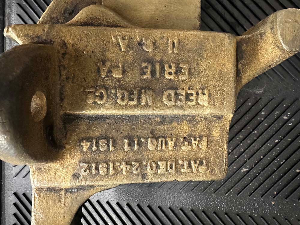 A piece of metal that says erie pa on it