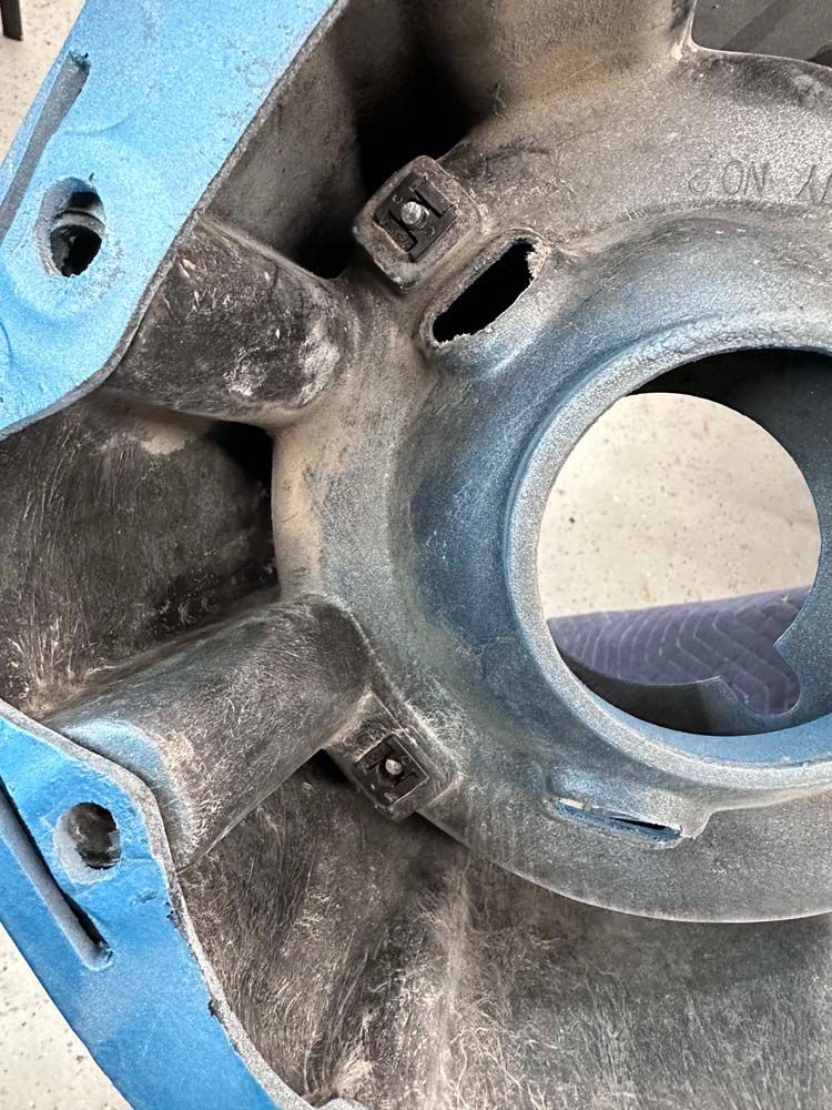 A close up of a metal object with a hole in the middle.