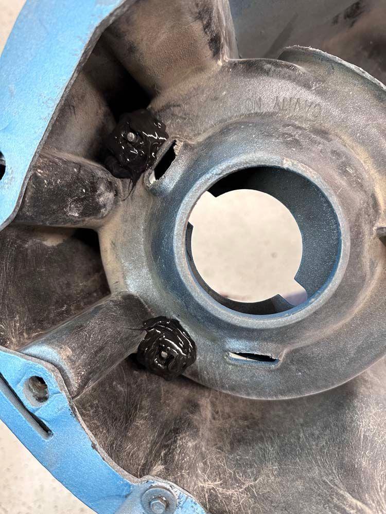 A close up of a metal object with a hole in it.