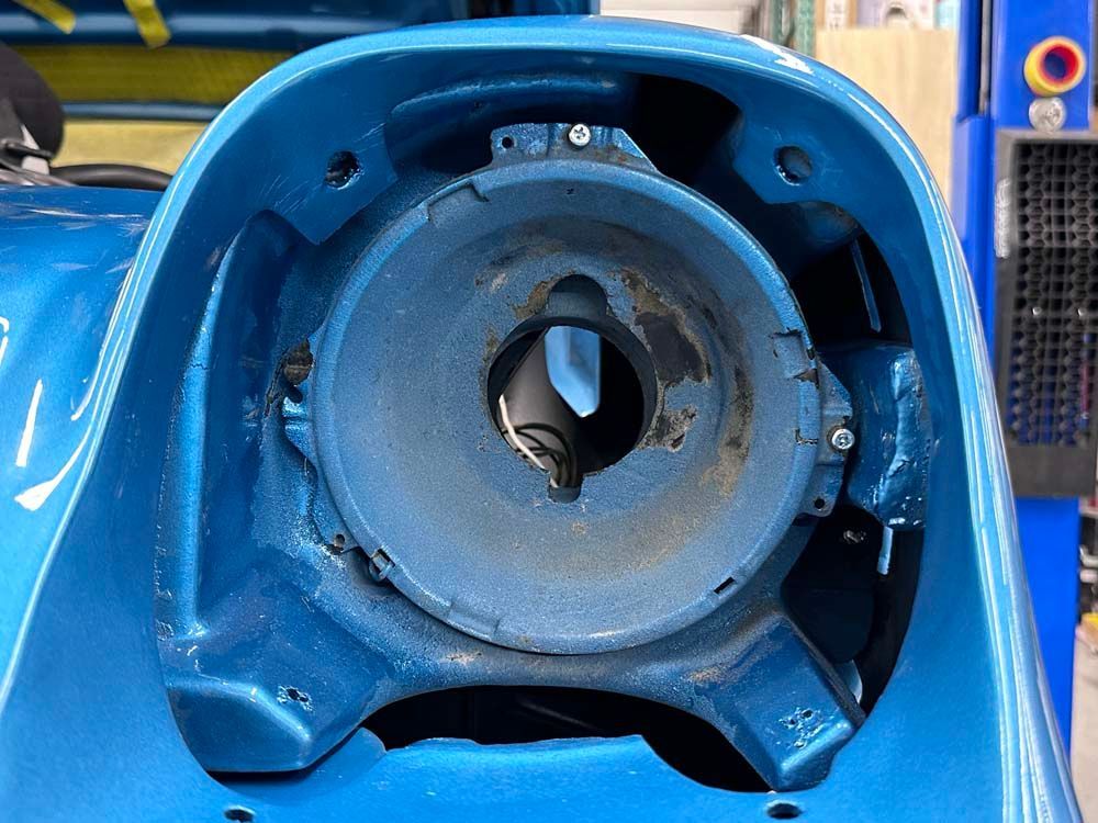 A close up of a blue object with a hole in it