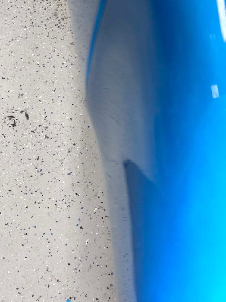 A close up of a blue and white surface with sparkles on it.