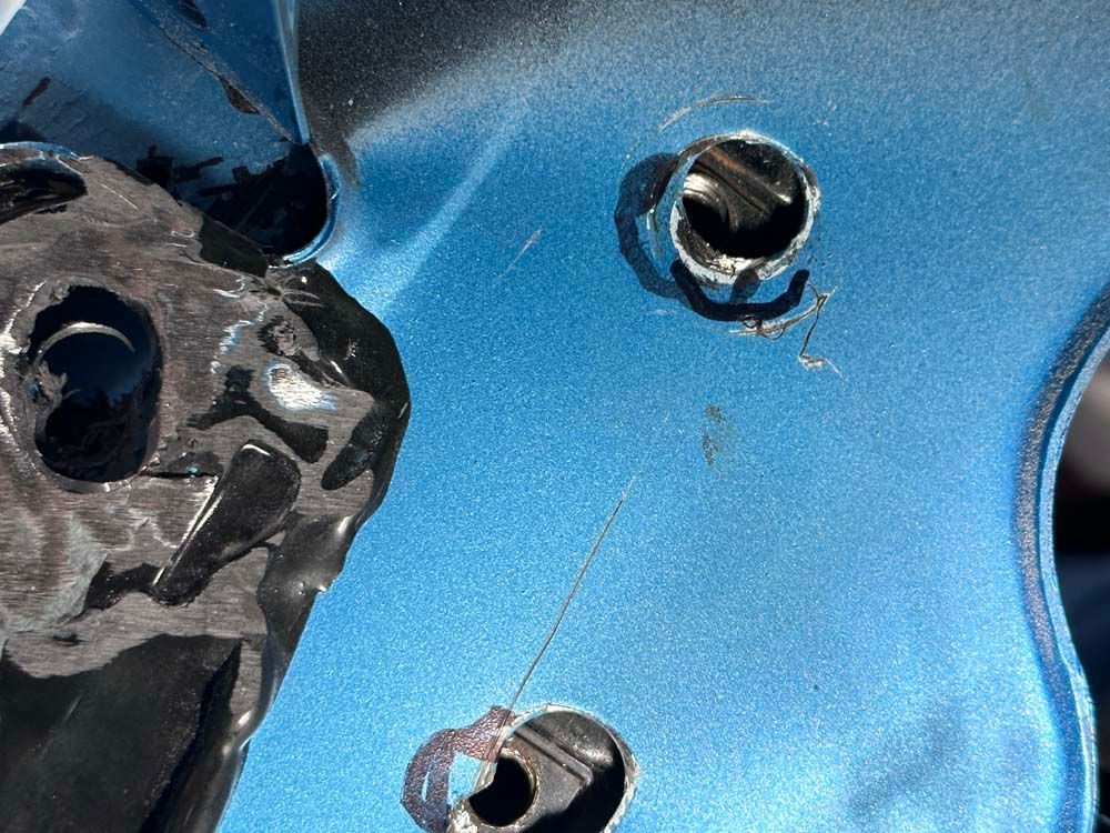 A close up of a blue object with holes in it