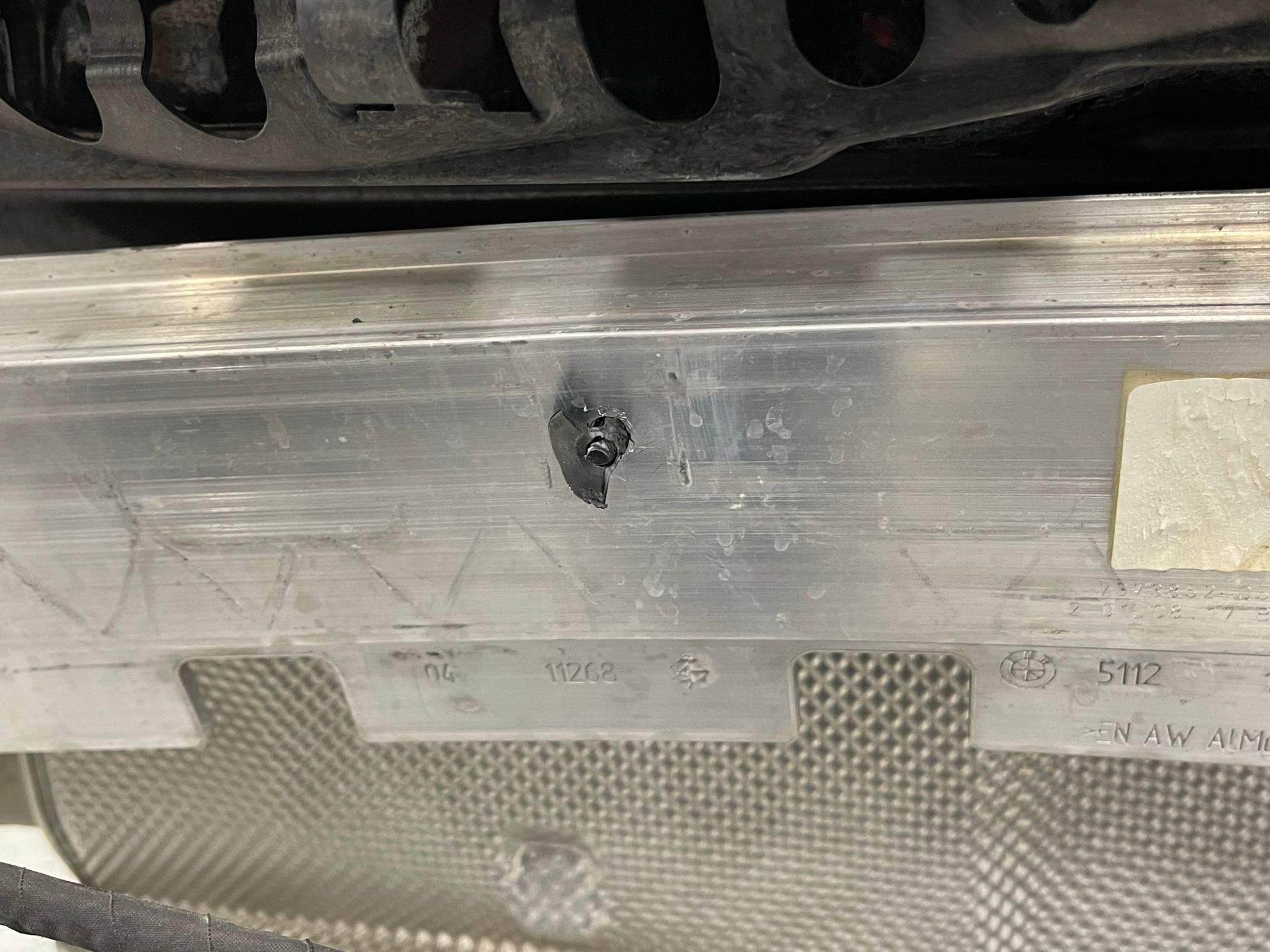 A close up of a metal item with a hole in it.