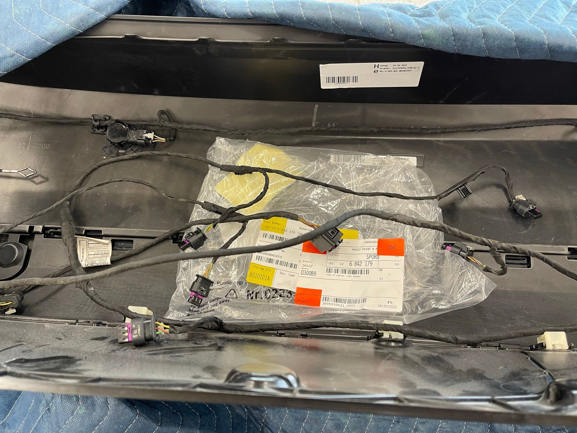 A bunch of wires are laying on top of a piece of metal.