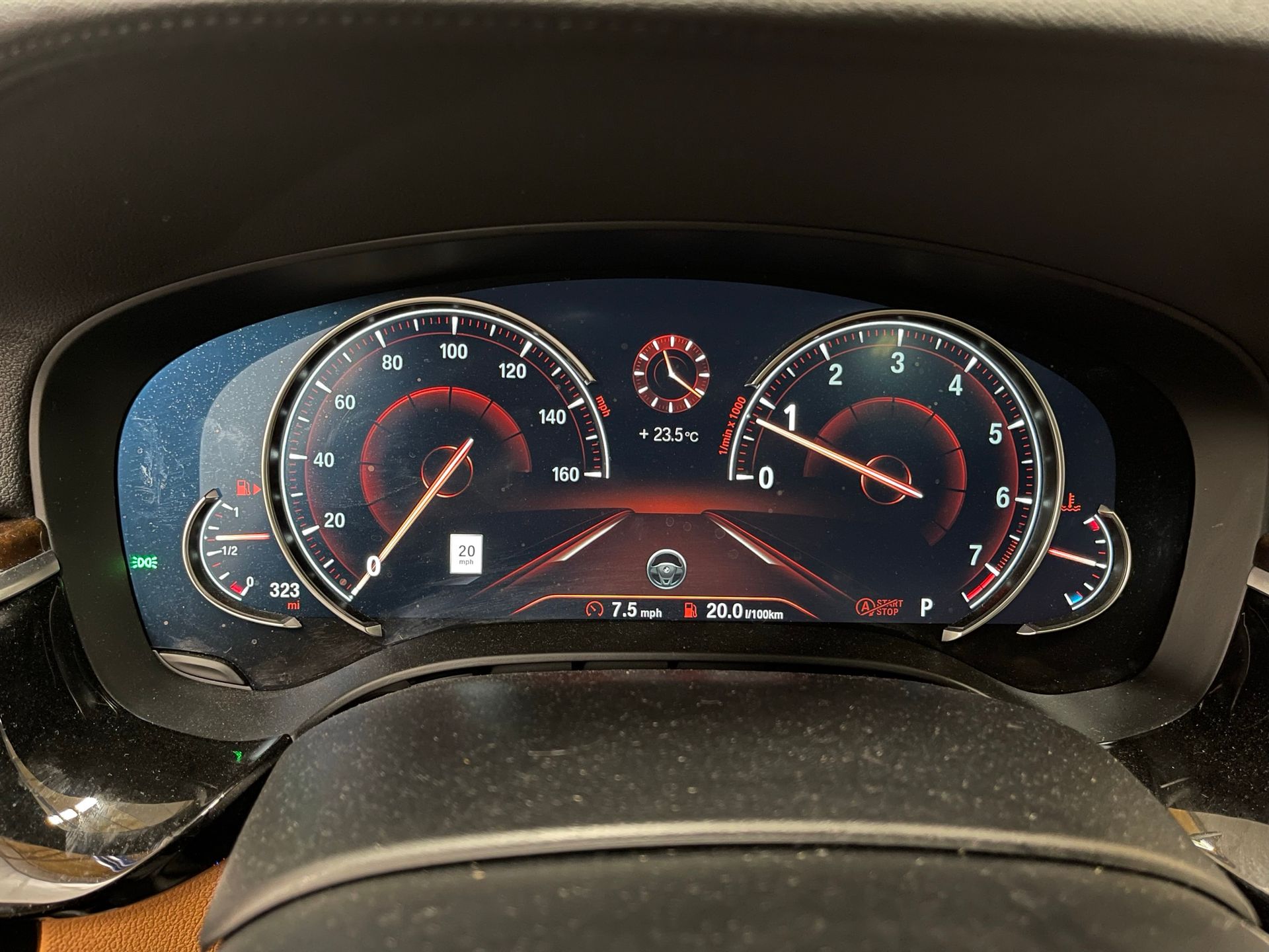A close up of a car dashboard with a clock on it