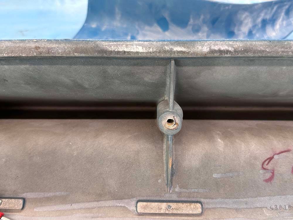 A close up of a metal object with a hole in the middle.