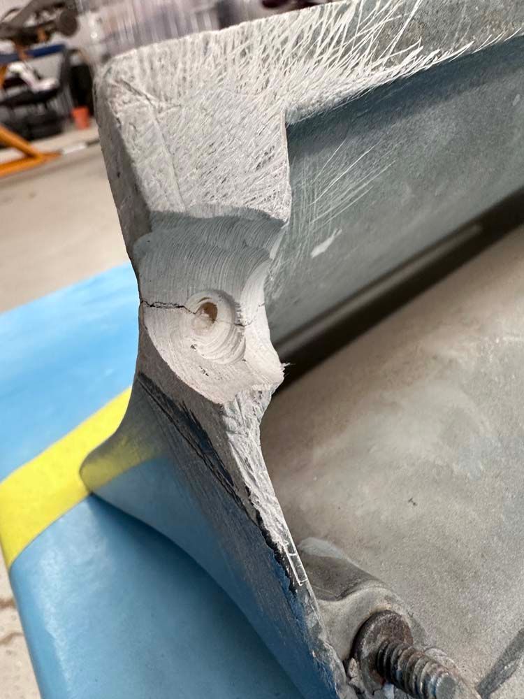 A piece of metal with a hole in it is sitting on a table.