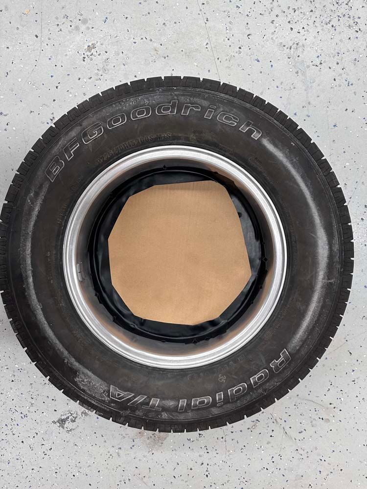 A close up of a tire on a concrete surface