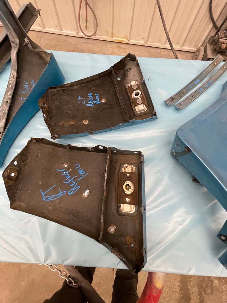 Two pieces of metal are sitting on top of a table.